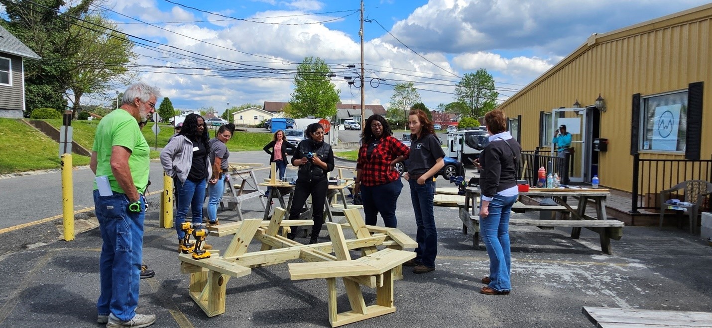 Kotagal and West Virginia Women Work pre-apprenticeship students and instructors constructing a picnic table during a carpentry lesson. (Photo courtesy of West Virginia Women Work) 